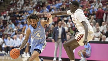 Feb 24, 2025; Tallahassee, Florida, USA; Florida State Seminoles forward Alier Maluk (21) defends North Carolina Tarheels guard RJ Davis (4) during the first half at Donald L. Tucker Center. Mandatory Credit: Melina Myers-Imagn Images