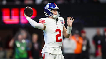 Dec 22, 2024; Atlanta, Georgia, USA; New York Giants quarterback Drew Lock (2) throws a pass against the Atlanta Falcons in the third quarter at Mercedes-Benz Stadium.  