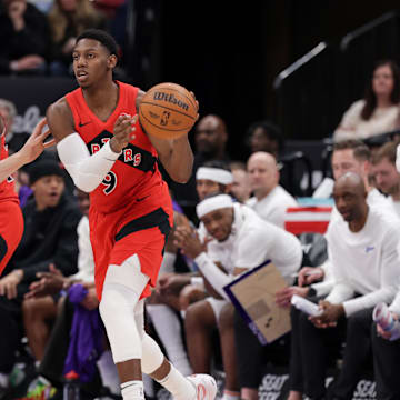 Mar 14, 2025; Salt Lake City, Utah, USA;  Toronto Raptors guard RJ Barrett (9) passes the ball away from Utah Jazz forward Lauri Markkanen (23) during the second quarter at Delta Center. Mandatory Credit: Chris Nicoll-Imagn Images