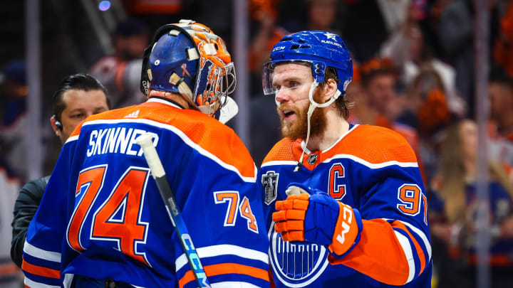 Jun 21, 2024; Edmonton, Alberta, CAN; Edmonton Oilers goaltender Stuart Skinner (74) and center Connor McDavid (97) celebrates win after defeating Florida Panthers in game six of the 2024 Stanley Cup Final at Rogers Place.