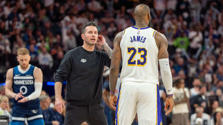 Apr 27, 2025; Minneapolis, Minnesota, USA; Los Angeles Lakers head coach JJ Redick talks with forward LeBron James (23) in the fourth quarter against the Minnesota Timberwolves during game four of first round for the 2025 NBA Playoffs at Target Center. Mandatory Credit: Matt Blewett-Imagn Images Apr 27, 2025; Minneapolis, Minnesota, USA; Los Angeles Lakers head coach JJ Redick talks with forward LeBron James (23) in the fourth quarter against the Minnesota Timberwolves during game four of first round for the 2025 NBA Playoffs at Target Center. Mandatory Credit: Matt Blewett-Imagn Images