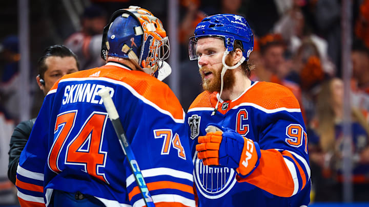 Jun 21, 2024; Edmonton, Alberta, CAN; Edmonton Oilers goaltender Stuart Skinner (74) and center Connor McDavid (97) celebrates win after defeating Florida Panthers in game six of the 2024 Stanley Cup Final at Rogers Place. Mandatory Credit: Sergei Belski-Imagn Images