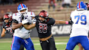 Defensive end Malaki Ta'ase (98) breaks through the Bulldog offense line to get into the backfield as the NMSU Aggies took on the Louisiana Tech Bulldogs, Tuesday night at Aggie Memorial Stadium, October 15, 2024.