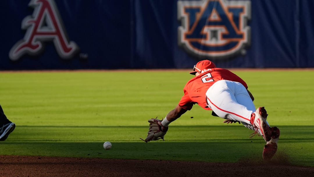 May 21, 2025; Hoover, AL, USA; Georgia second baseman Ryan Black (2) dives for a ball hit up the middle during the game with Oklahoma in the second round of the SEC Baseball Tournament at the Hoover Met.