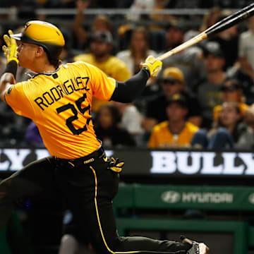 Sep 29, 2023; Pittsburgh, Pennsylvania, USA;  Pittsburgh Pirates catcher Endy Rodriguez (25) hits a single against the Miami Marlins during the sixth inning at PNC Park. Mandatory Credit: Charles LeClaire-Imagn Images