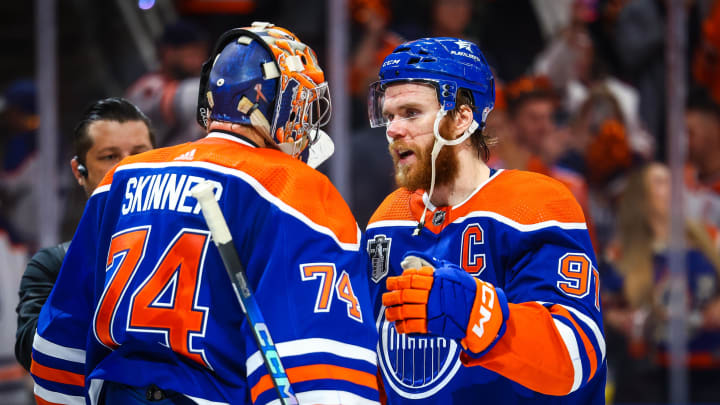 Jun 21, 2024; Edmonton, Alberta, CAN; Edmonton Oilers goaltender Stuart Skinner (74) and center Connor McDavid (97) celebrates win after defeating Florida Panthers in game six of the 2024 Stanley Cup Final at Rogers Place. Mandatory Credit: Sergei Belski-USA TODAY Sports