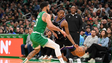 Apr 5, 2024; Boston, Massachusetts, USA; Boston Celtics forward Jayson Tatum (0) defends against Sacramento Kings guard De'Aaron Fox (5) during the second half at TD Garden. Mandatory Credit: Eric Canha-USA TODAY Sports