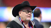 Professional wrestling commentator Jim Ross looks on before the 2019 Peach Bowl college football playoff semifinal game between the LSU Tigers and the Oklahoma Sooners.