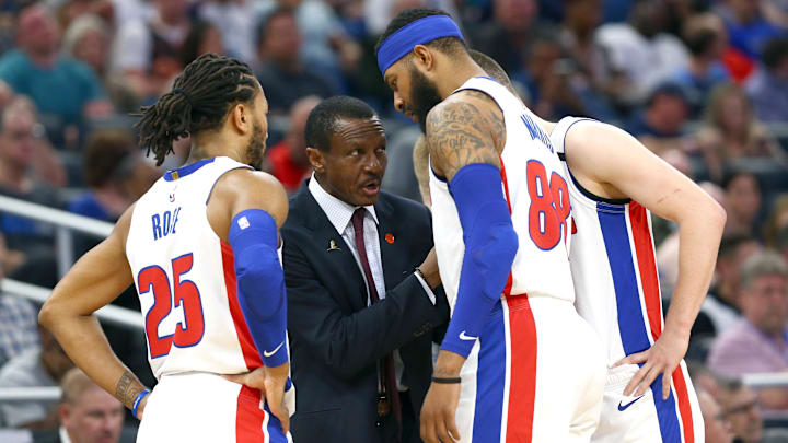 Feb 12, 2020; Orlando, Florida, USA; Detroit Pistons head coach Dwane Casey huddles with  guard Derrick Rose (25) and forward Markieff Morris (88) during the second half against the Orlando Magic at Amway Center. Mandatory Credit: Kim Klement-Imagn Images