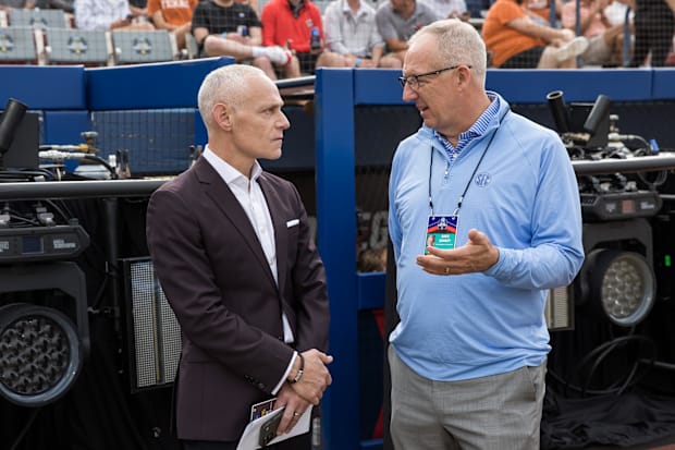 Big 12 commissioner Brett Yormark (left) and SEC commissioner Greg Sankey talk before the game between Texas and Texas Tech.
