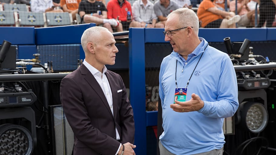 Big 12 commissioner Brett Yormark (left) and SEC commissioner Greg Sankey talk before the game between Texas and Texas Tech.