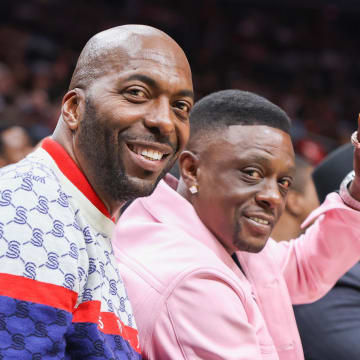 Apr 5, 2023; Atlanta, Georgia, USA; Former NBA player John Salley sits with rapper Boosie Badazz at a game between the Washington Wizards and Atlanta Hawks in the first half at State Farm Arena. Mandatory Credit: Brett Davis-USA TODAY Sports

