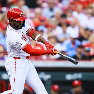 Aug 13, 2025; Cincinnati, Ohio, USA; Cincinnati Reds designated hitter Miguel Andujar (38) hits a single in the second inning against the Philadelphia Phillies at Great American Ball Park. Mandatory Credit: Katie Stratman-Imagn Images