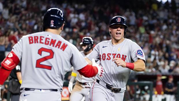 Boston Red Sox base runner Nate Eaton (right) celebrates with Alex Bregman