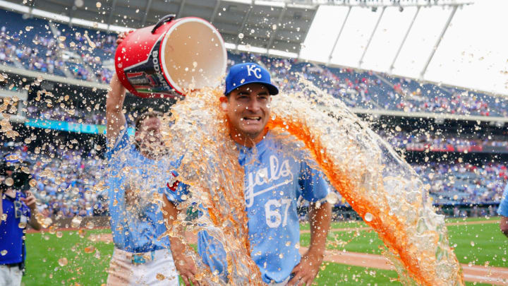 Jul 21, 2024; Kansas City, Missouri, USA; After pitching a complete game, Kansas City Royals starting pitcher Seth Lugo (67) is doused by shortstop Bobby Witt Jr. (7) after the win over the Chicago White Sox at Kauffman Stadium. Mandatory Credit: Denny Medley-USA TODAY Sports