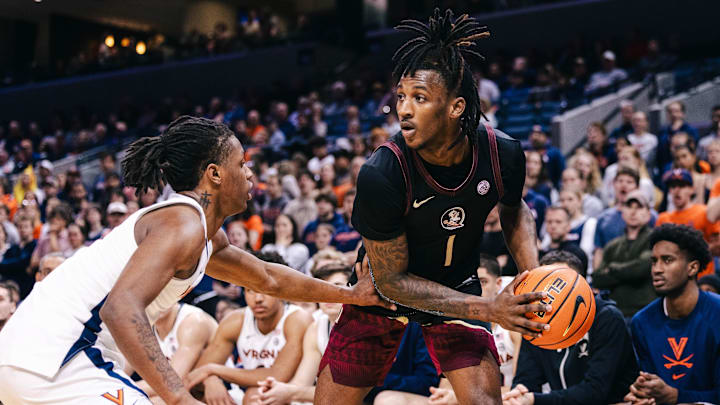 Mar 4, 2025; Charlottesville, Virginia, USA; Florida State Seminoles guard Jamir Watkins (1) controls the ball while Virginia Cavaliers guard Dai Dai Ames (7) defends in the first half at John Paul Jones Arena. Mandatory Credit: Emily Faith Morgan-Imagn Images Mar 4, 2025; Charlottesville, Virginia, USA; Florida State Seminoles guard Jamir Watkins (1) controls the ball while Virginia Cavaliers guard Dai Dai Ames (7) defends in the first half at John Paul Jones Arena. Mandatory Credit: Emily Faith Morgan-Imagn Images