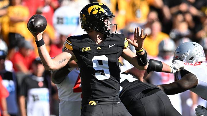Oct 3, 2026; Iowa City, Iowa, USA;  Iowa Hawkeyes quarterback Hank Brown (9) passes against the Ohio State Buckeyes during the first half at Kinnick Stadium.  Mandatory Credit: Jeffrey Becker-Imagn Images