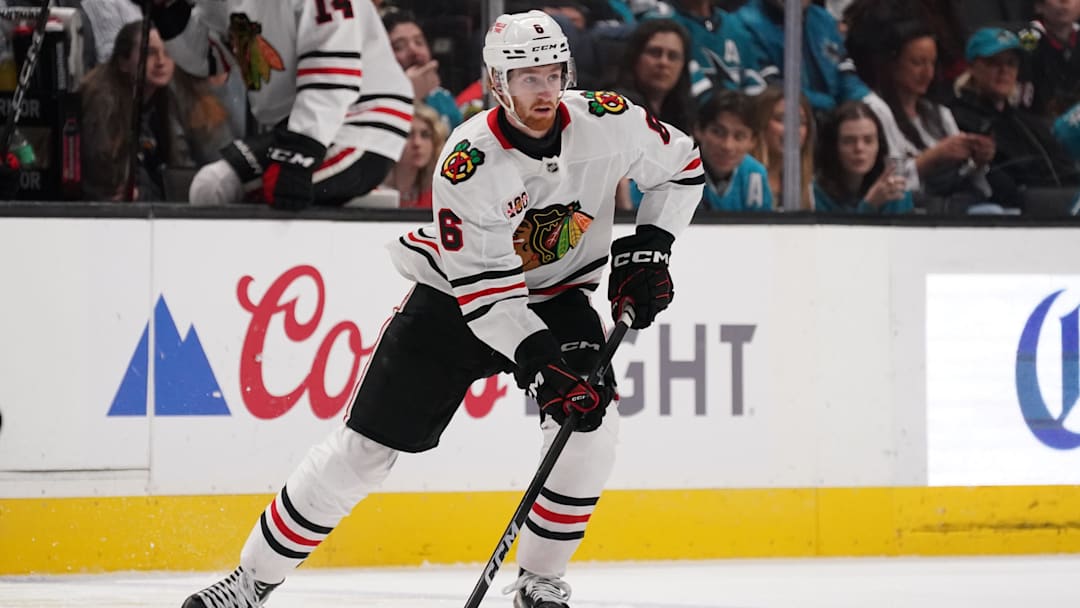 Apr 6, 2026; San Jose, California, USA;  Chicago Blackhawks defenseman Sam Rinzel (6) controls the puck against the San Jose Sharks in the first period at SAP Center at San Jose. Mandatory Credit: David Gonzales-Imagn Images