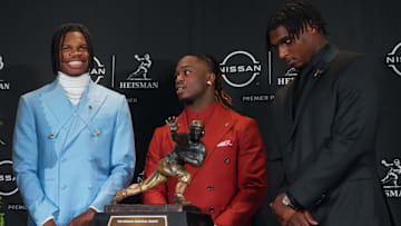 Dec 14, 2024; New York, NY, USA; From left, Heisman Trophy nominees Oregon Ducks quarterback Dillon Gabriel, Colorado Buffaloes wide receiver/cornerback Travis Hunter, Boise State Broncos running back Ashton Jeanty and Miami Hurricanes quarterback Cam Ward pose for a photo during a press conference before the 2024 Heisman Trophy Presentation. Mandatory Credit: Lucas Boland-Imagn Images