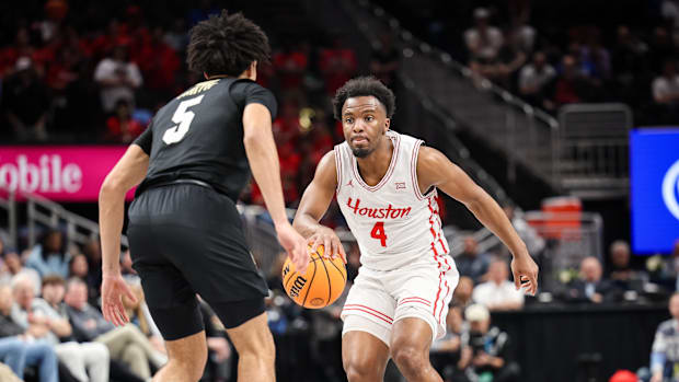 Houston Cougars guard L.J. Cryer guards Colorado Buffaloes guard RJ Smith
