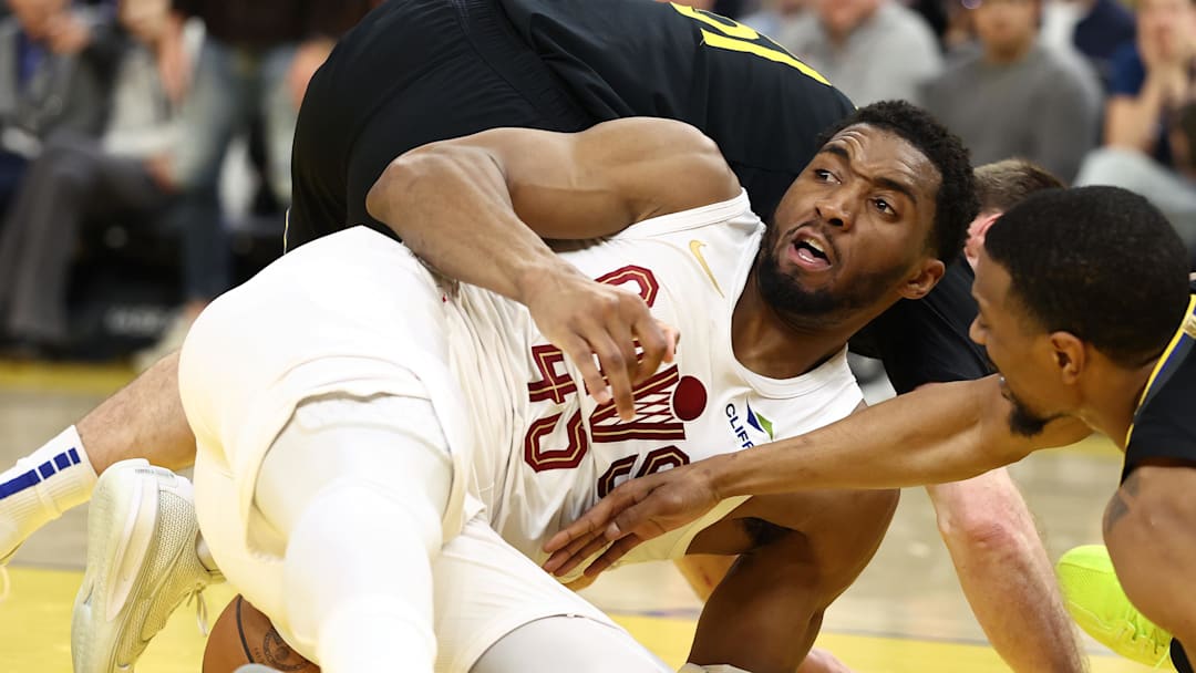 Apr 2, 2026; San Francisco, California, USA; Golden State Warriors guard Pat Spencer (61), Cleveland Cavaliers guard Donovan Mitchell (45), and Golden State Warriors forward/center De'Anthony Melton (8) battle for a loose ball during the second quarter at Chase Center. Mandatory Credit: Kelley L Cox-Imagn Images