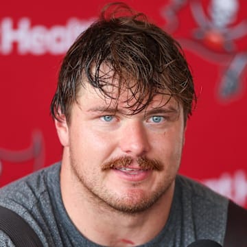 Tampa Bay Buccaneers offensive tackle Luke Goedeke (67) talks to media after training camp at AdventHealth Training Center. 
