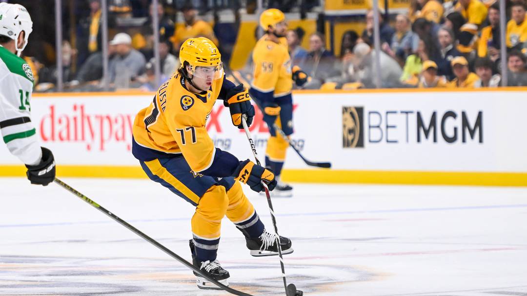 Oct 10, 2024; Nashville, Tennessee, USA;  Nashville Predators right wing Luke Evangelista (77) skates against the Dallas Stars during the first period at Bridgestone Arena. Mandatory Credit: Steve Roberts-Imagn Images