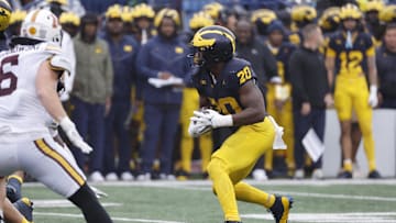 Sep 28, 2024; Ann Arbor, Michigan, USA;  Michigan Wolverines running back Kalel Mullings (20) rushes in the first half against the Minnesota Golden Gophers at Michigan Stadium. Mandatory Credit: Rick Osentoski-Imagn Images