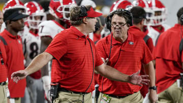 Georgia Bulldogs head coach Kirby Smart and assistant coach Will Muschamp