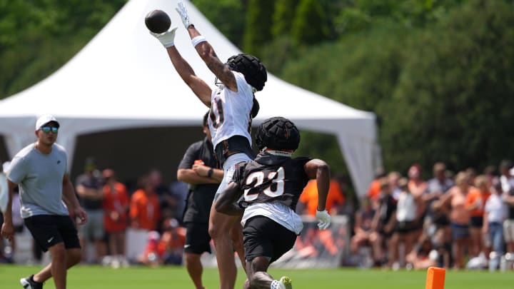 Jul 26, 2024; Cincinnati, OH, USA; Cincinnati Bengals wide receiver Andrei Iosivas (80) catches a pass against safety Dax Hill (23) during training camp practice at Kettering Health Practice Fields. Mandatory Credit: Kareem Elgazzar-USA TODAY Sports