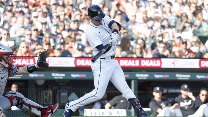 Jul 27, 2024; Detroit, Michigan, USA; Detroit Tigers first baseman Mark Canha (21) hits a single in the first inning against the Minnesota Twins at Comerica Park. Mandatory Credit: Brian Bradshaw Sevald-USA TODAY Sports