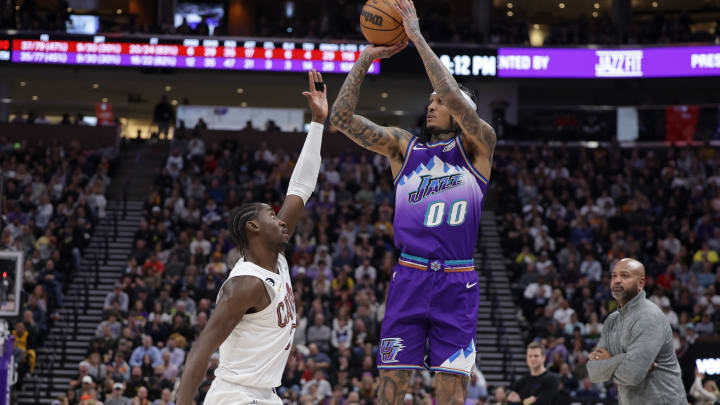 Jan 10, 2023; Salt Lake City, Utah, USA;  Utah Jazz guard Jordan Clarkson (00) shoots the ball over Cleveland Cavaliers guard Caris LeVert (3) during the fourth quarter at Vivint Arena. Mandatory Credit: Chris Nicoll-USA TODAY Sports