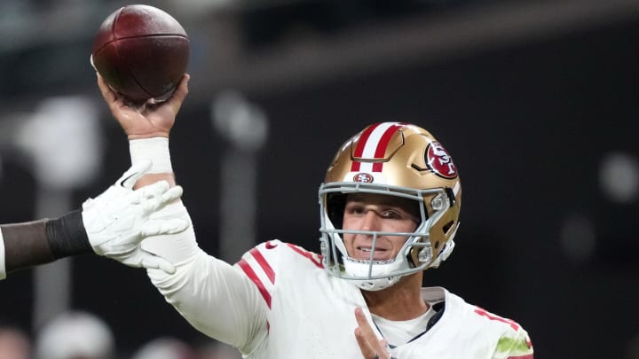 Aug 23, 2024; Paradise, Nevada, USA; San Francisco 49ers quarterback Brock Purdy (13) throws the ball against Las Vegas Raiders defensive end Janarius Robinson (97) in the first half at Allegiant Stadium.