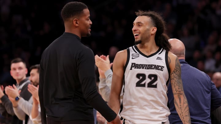 Mar 13, 2024; New York City, NY, USA; Providence Friars head coach Kim English shakes hands with guard Devin Carter (22) after taking him out of the game during the second half against the Georgetown Hoyas at Madison Square Garden. Mandatory Credit: Brad Penner-USA TODAY Sports