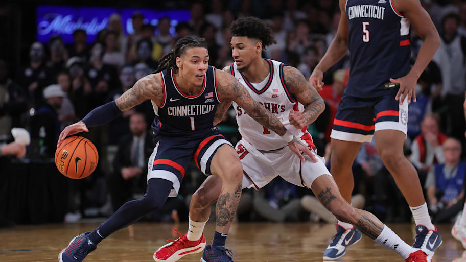 UConn guard Solo Ball dribbles against St. John’s forward Dillon Mitchell during the second half of the Big East title game.