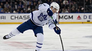 Mar 20, 2025; New York, New York, USA;  Toronto Maple Leafs left wing Scott Laughton (24) attempts a shot against the New York Rangers during the first period at Madison Square Garden. Mandatory Credit: Dennis Schneidler-Imagn Images