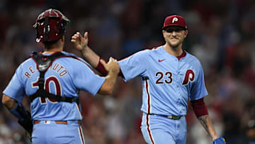 Aug 29, 2024; Philadelphia, Pennsylvania, USA; Philadelphia Phillies pitcher Jeff Hoffman (23) and catcher J.T. Realmuto (10) shake hands after a victory against the Atlanta Braves at Citizens Bank Park. Mandatory Credit: Bill Streicher-Imagn Images