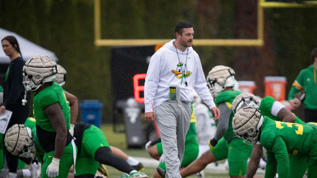 Oregon head coach Dan Lanning walks the field during practice with the Oregon Ducks