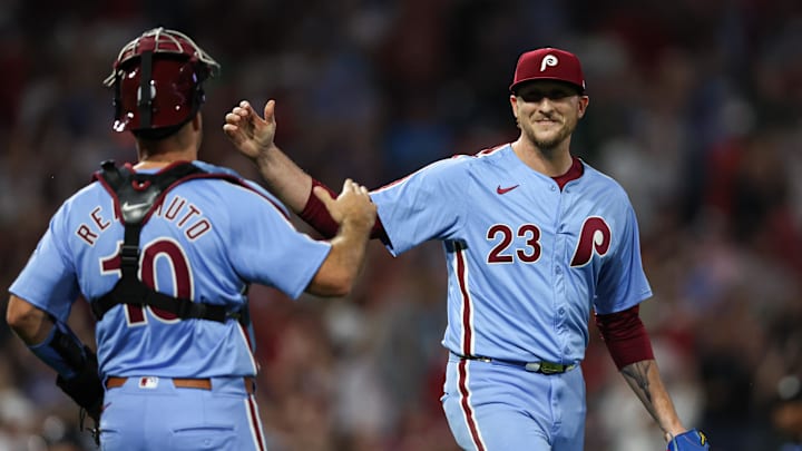 Aug 29, 2024; Philadelphia, Pennsylvania, USA; Philadelphia Phillies pitcher Jeff Hoffman (23) and catcher J.T. Realmuto (10) shake hands after a victory against the Atlanta Braves at Citizens Bank Park. Mandatory Credit: Bill Streicher-Imagn Images