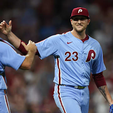 Aug 29, 2024; Philadelphia, Pennsylvania, USA; Philadelphia Phillies pitcher Jeff Hoffman (23) and catcher J.T. Realmuto (10) shake hands after a victory against the Atlanta Braves at Citizens Bank Park.