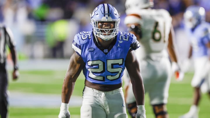 Oct 14, 2023; Chapel Hill, North Carolina, USA; North Carolina Tar Heels linebacker Kaimon Rucker (25) celebrates after sacking the Miami Hurricanes quarterback in the second half at Kenan Memorial Stadium. Mandatory Credit: Nell Redmond-USA TODAY Sports