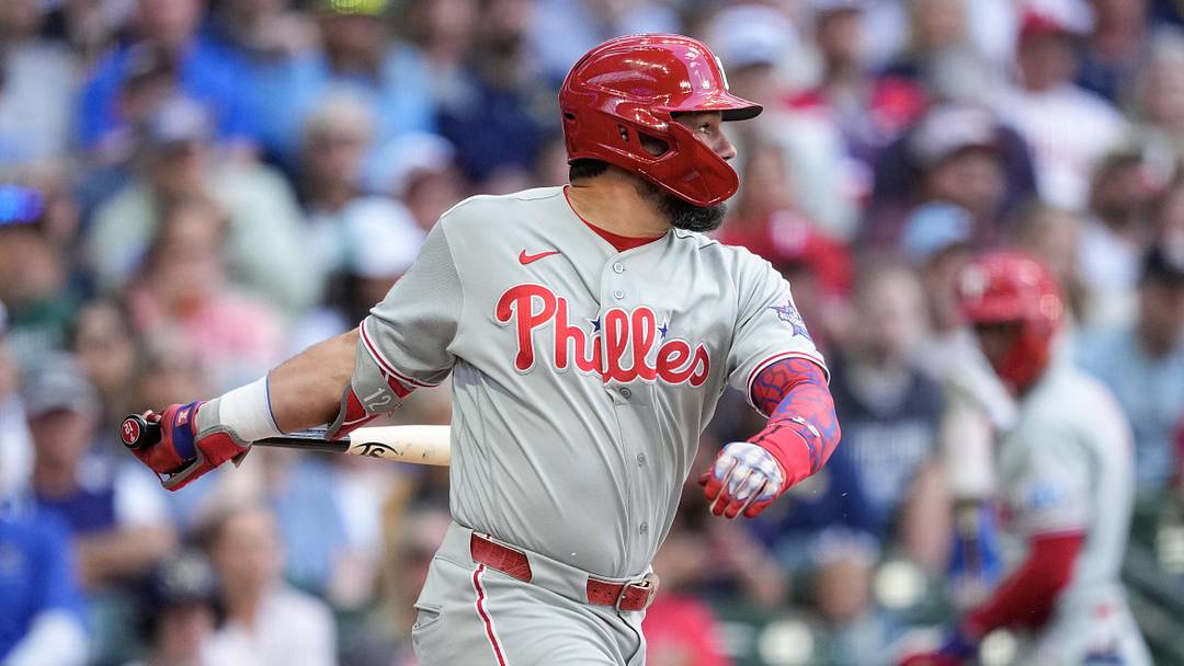 Jun 14, 2026; Milwaukee, Wisconsin, USA;  Philadelphia Phillies designated hitter Kyle Schwarber (12) singles during the sixth inning against the Milwaukee Brewers at American Family Field. 