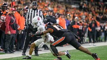 Nov 23, 2024; Corvallis, Oregon, USA; Oregon State Beavers defensive back Skyler Thomas (17) tackles Washington State Cougars wide receiver Kris Hutson (1) after a catch close to the end zone during the second quarter at Reser Stadium. Mandatory Credit: Craig Strobeck-Imagn Images
