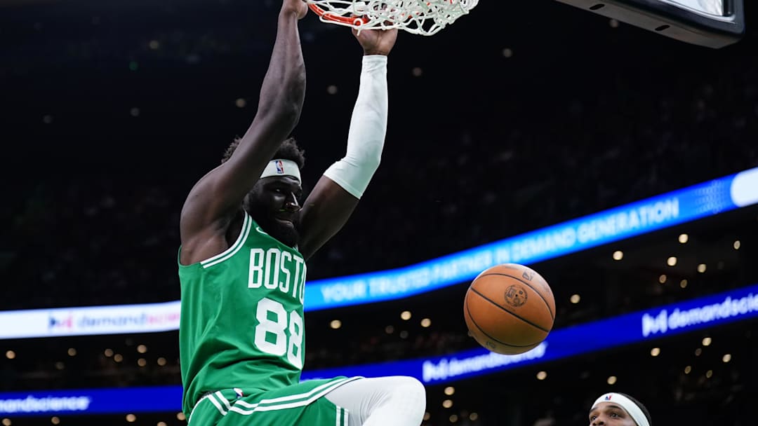 Apr 12, 2024; Boston, Massachusetts, USA; Boston Celtics center Neemias Queta (88) makes the basket against the Charlotte Hornets in the second quarter at TD Garden. Mandatory Credit: David Butler II-Imagn Images