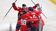 Apr 4, 2025; Washington, District of Columbia, USA; Washington Capitals left wing Alex Ovechkin (8) celebrates with teammates after scoring a goal against the Chicago Blackhawks in the third period at Capital One Arena. The goal is the 894th of his career, tying Wayne Gretzky (not pictured) for most all-time goals scored in the NHL. Mandatory Credit: Amber Searls-Imagn Images