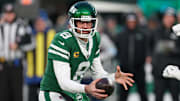 Jan 5, 2025; East Rutherford, New Jersey, USA; New York Jets quarterback Aaron Rodgers (8) fakes a hand off during the first quarter against the Miami Dolphins at MetLife Stadium. Mandatory Credit: Vincent Carchietta-Imagn Images