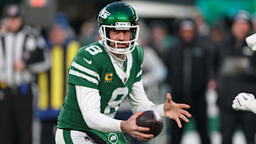 Jan 5, 2025; East Rutherford, New Jersey, USA; New York Jets quarterback Aaron Rodgers (8) fakes a hand off during the first quarter against the Miami Dolphins at MetLife Stadium. Mandatory Credit: Vincent Carchietta-Imagn Images