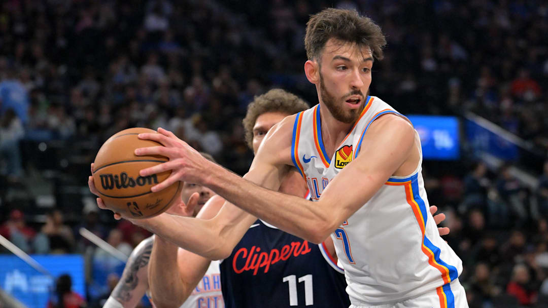 Apr 8, 2026; Inglewood, California, USA;  Oklahoma City Thunder center Chet Holmgren (7) reaches in front of Los Angeles Clippers center Brook Lopez (11) for a rebound in the first half at Intuit Dome. Mandatory Credit: Jayne Kamin-Oncea-Imagn Images