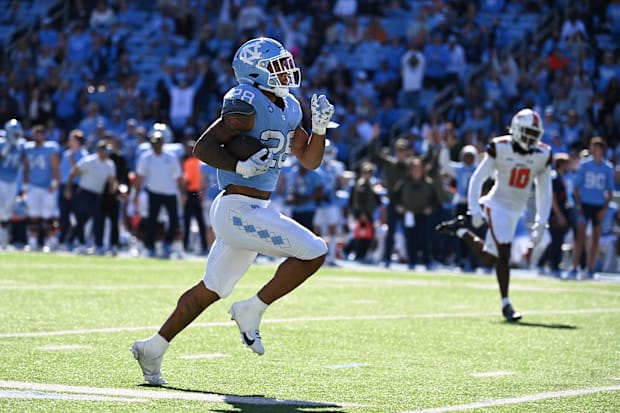 North Carolina Tar Heels running back Omarion Hampton runs for a touchdown in the second quarter at Kenan Memorial Stadium.