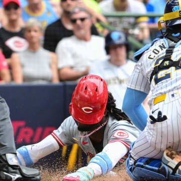 Jun 16, 2024; Milwaukee, Wisconsin, USA; Cincinnati Reds shortstop Elly De La Cruz (44) scores after an error before the tag by Milwaukee Brewers catcher William Contreras (24) in the third inning at American Family Field. Mandatory Credit: Benny Sieu-USA TODAY Sports